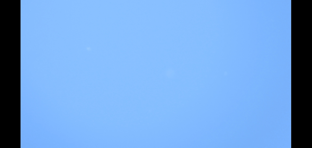 Low-contrast sky patches; the bright main loop is not visible in this frame.